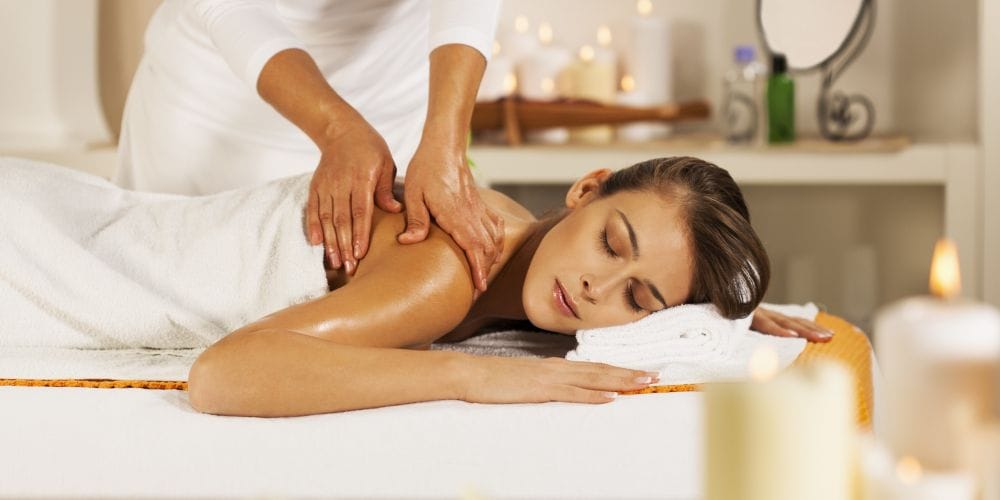Woman receiving a massage at a massage studio.